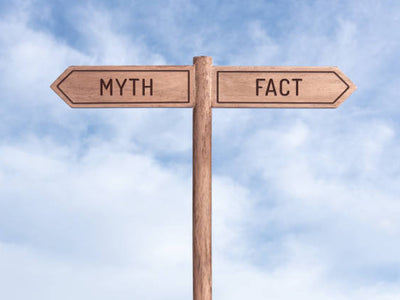 a sign with myth and fact pointing 2 different directions