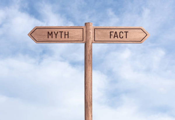 a sign with myth and fact pointing 2 different directions