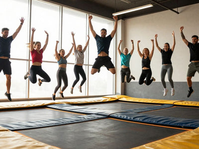 Adults jumping on trampolines in a fitness class.