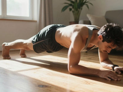 Person doing a push-up at home, no equipment needed.