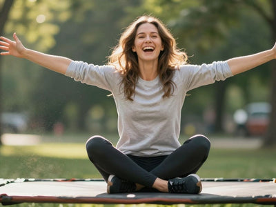 Adult joyfully jumping high on an outdoor trampoline.