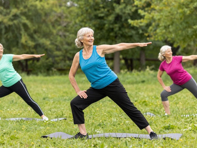 Active seniors exercising outdoors for belly fat loss.