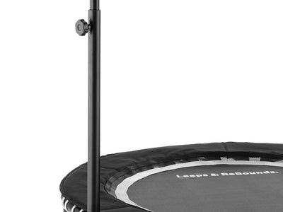 Small exercise trampoline with a handlebar, black and white design.