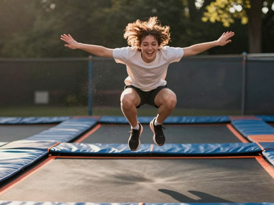Person joyfully jumping high on a trampoline.