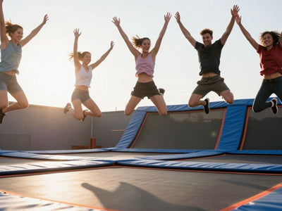 People jumping on a trampoline for fitness.