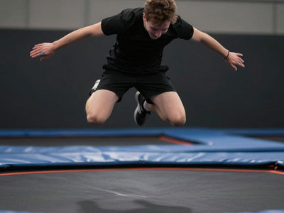 Person bouncing high on a trampoline.