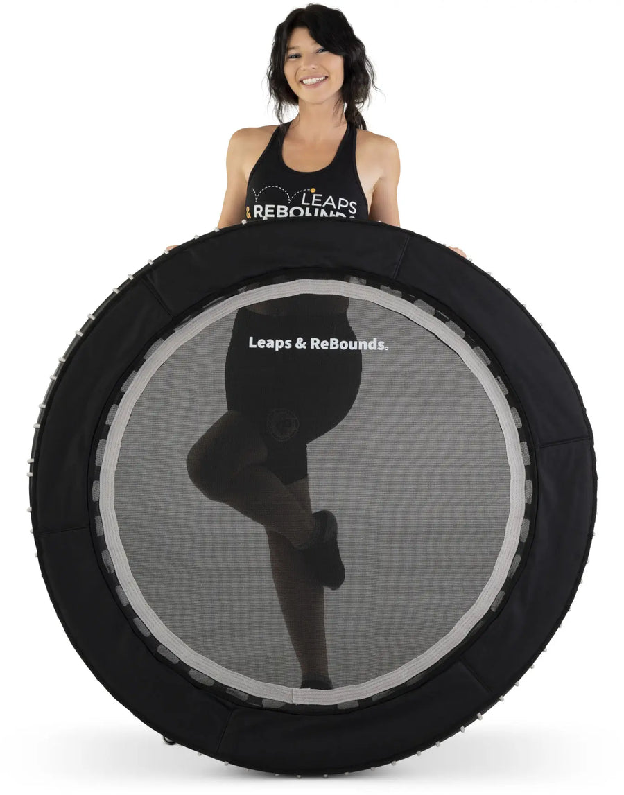 Model standing behind a Leaps & Rebounds Rebounder