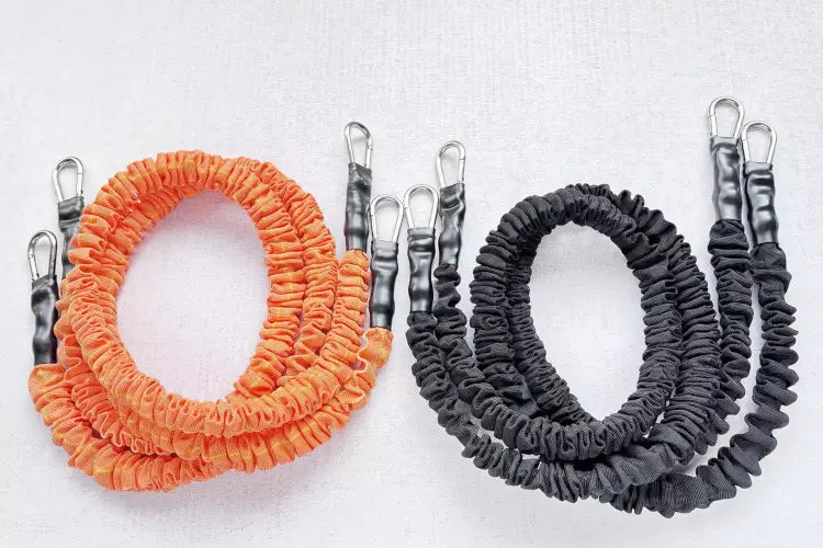 orange and black resistance bands side by side