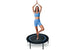 Woman exercising on a Leaps and Rebounds fitness trampoline with a white background